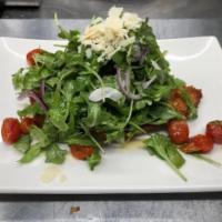 Chicken Milanese · Breaded, Served with Arugula, Tomato & Shaved Parmesan