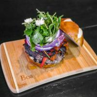 Portobello Burger · Portobello mushroom burger topped with goat cheese, grilled red onion, roasted peppers, arug...