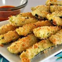 Zucchini Sticks · Perfectly breaded and deep fried. Served with Ranch dressing