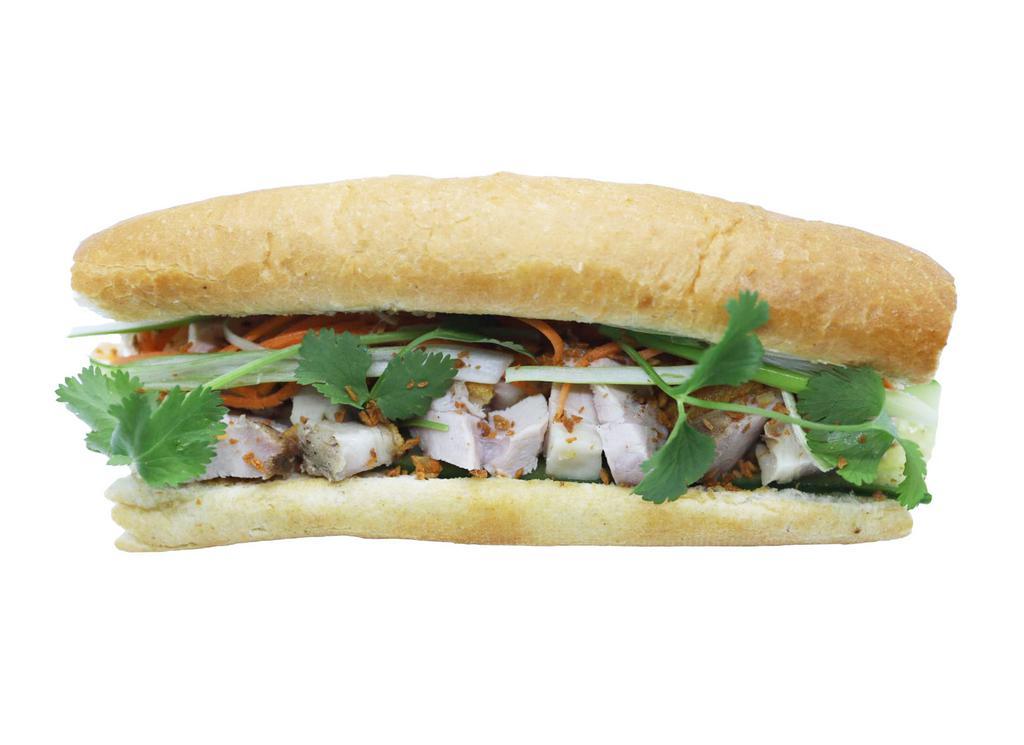 Banh Mi  Crispy Pork Belly Sandwich · Crispy pork belly sandwich. Crispy pork belly, cucumber, Viet coriander, cilantro, Heo Teo sauce.