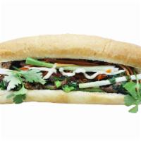 Banh Mi Grilled Pork witth lemongrass ·  Grilled pork with lemongrass, cilantro, green onion, mayo, pickle carrot, Heo Teo sauce.