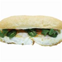 Banh Mi Sunny Side up or Omelette · Omelette, cucumber, cilantro, green onion, Heo Teo sauce or salt and pepper.