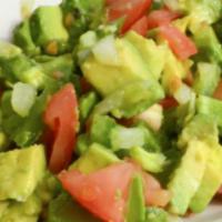 Guacamole Casero · Chunks of avocado mixed with cilantro, tomatoes, jalapenos, onions, and lime.