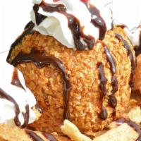 Deep Fried Ice Cream · Vanilla ice cream covered with coconut and corn flakes. Topped with whipped cream, chocolate...