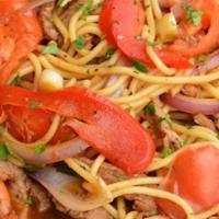 Tallarin Saltado de Pollo · Spaghetti mixed with fresh chicken sauteed in oil, red and green onions, tomatoes, red and y...