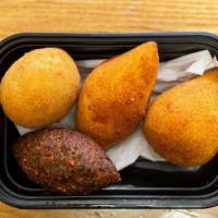 Traditional Coxinha · A popular food in brazil consisting of chopped or shredded chicken meat, covered in dough, m...