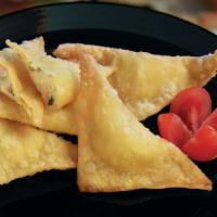 A4. Crab Rangoon · Includes 5 pieces.  Crabmeat & cream cheese filled then fried.