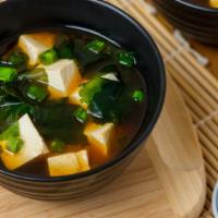 JA7. Miso Soup · Soybean base soup with tofu, seaweed, and green onions.