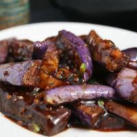 V7. Spicy Eggplant · Eggplant stir fried with onions in a sweet and spicy sauce. Hot and spicy.