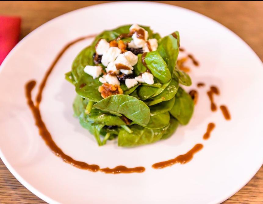 Spinach Salad · Balsamic agave vinaigrette, goat cheese, dried cherries and walnuts.