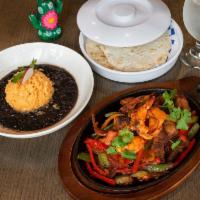 Mixed Fajita · (Served with rice beans, Sautéed peppers, onions and lour tortillas.)
