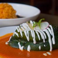 Shrimp Chile Relleno · Roasted poblano pepper stuffed with shrimp, corn and jack cheese. Served with rice and beans...