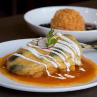Chile Relleno (Classic) · Roasted poblano pepper stuffed with Oaxaca cheese in tomato sauce. Served with rice & beans. 