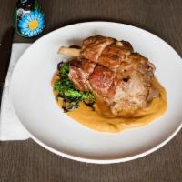 Chamorro · Braised pork shank in dark beer. Served with sweet potato puree and broccoli rabe.