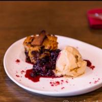 Bread Pudding · Served with salted caramel gelato and berry sauce.