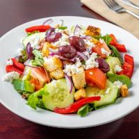Greek Salad · Fresh mesclun, tomato, cucumber, Kalamata olives, sweet red onion, and imported feta cheese.