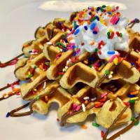 Waffles · 334 calories. 34g of protein. 24g of carbohydrates. Vitamin a. vitamin c. calcium. Iron.
