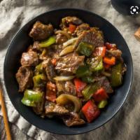 79. Pepper Steak with Onion · Stir fried steak with vegetables and a savory sauce.