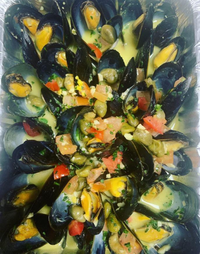 Mussels · Sauteed with capers, garlic, Dijon mustard and a white wine sauce.