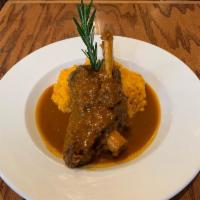 Lamb Shank · Oven braised with red wine and fresh herbs over saffron risotto.