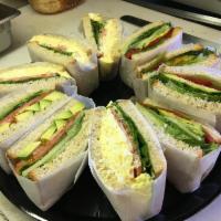 Stuffed Sandwiches Platter · Homemade focaccia bread filled with pesto sauce, mozzarella, melanzane sauce, eggplant, avoc...