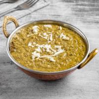 82. Palak Paneer · Homemade cheese, spinach, and Indian spices.