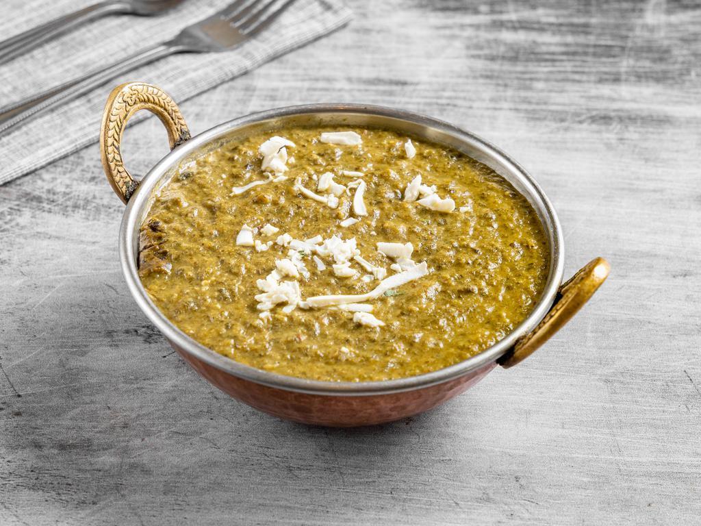 82. Palak Paneer · Homemade cheese, spinach, and Indian spices.