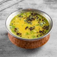 102. Yellow Dal · Lentils cooked with Indian spices.