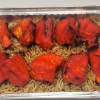 Chicken Tikka Kabab Platter  · Served over brown basmati with choice of salad and  sauce.
