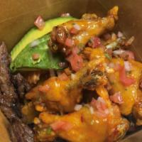 steak & chicken box · medium well cooked steak ,mango habanero wings ,tostones topped with chimi sauce & pico de g...
