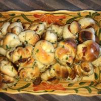Garlic Knots · Rolled baked garlic bread. 