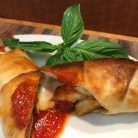 Chicken Roll · Pizza dough rolled with tender strips of chicken, tomato sauce and mozzarella cheese. 