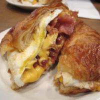 CROISSANT w/2 EGGS & SHARP CHEDDAR  · Add homefries for an additional charge.