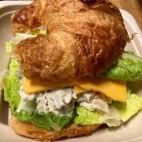 CROISSANT CHICKEN SALAD SANDWICH · House made chicken salad with sharp cheddar, lettuce on flaky croissant made baked in house