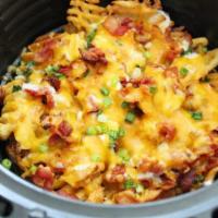 Loaded Tator Tots  · Seasoned Tator Tots topped with cheese ,bacon and ranch and chives 