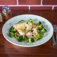 Penne Pasta · Served with chicken, shrimp, and broccoli in a scampi sauce.