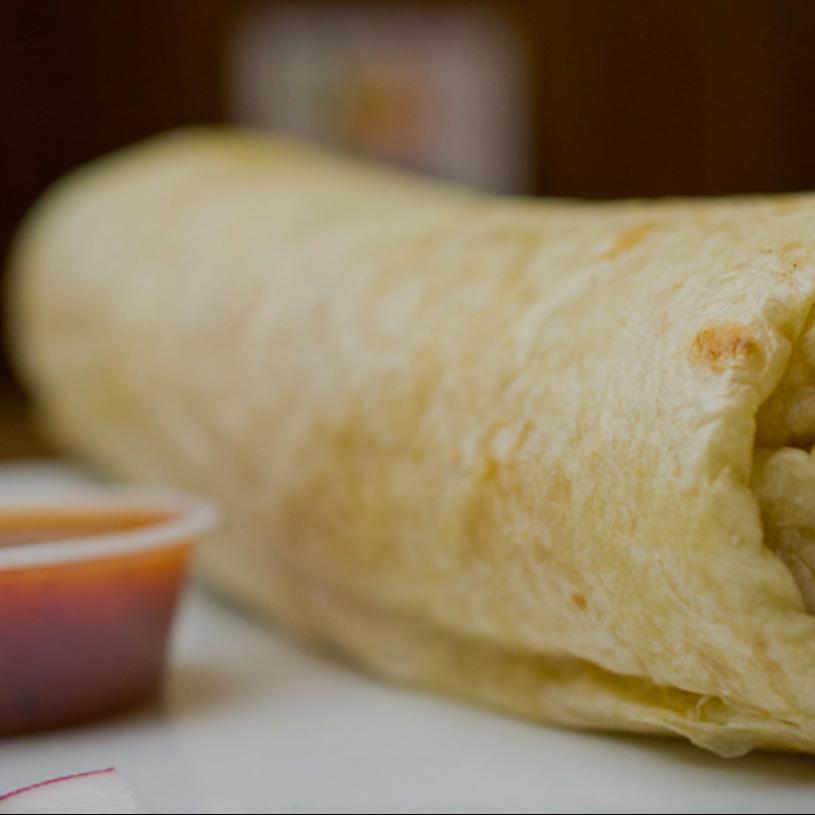 Regular Burrito · Flour tortilla with choice of protein and comes with rice, beans, onions, cilantro and choice of salsa