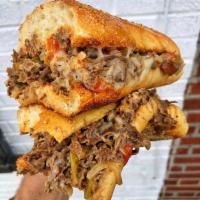 The Spencer · Philly Steak, Melted Provolone, Peppers & Onions, Roasted Red Pepper Aioli. 
Served on a Toa...
