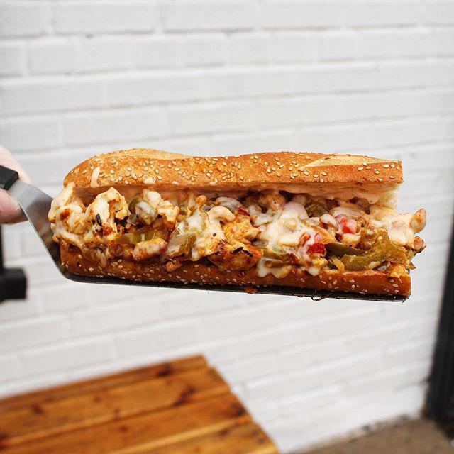 Chopped Chicken Philly · Marinated Chopped Grilled Chicken with Caramelized Onions and Peppers, Melted Provolone Cheese with Roasted Red Pepper Aioli. 
Served on a Toasted Seeded Semolina Hero