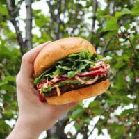 🌱 Veggie Burger  · Plant Based Patty, Avocado, Arugula, Tomato, Red Onion, Roasted Red Peppers Aioli, and Fig G...