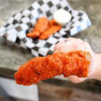 Sticky Tenders · 4 crispy chicken tenders tossed in our homemade honey dijon buffalo sauce.
Served with a sid...