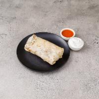 B1. Chicken Burrito · Served in a large fresh tortilla with rice, black beans, cheddar cheese, guacamole, lettuce ...
