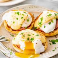 Eggs Benedict · English muffin, poached egg, Canadian bacon & maple hollandaise over mixed greens or potatoes