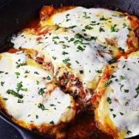 Chicken Parmesan · Over Pasta with Tomato Sauce