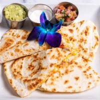 Chicken Quesadilla · 12 inch tortilla with peppers, onions, melted cheese, guacamole, salsa roja & sour cream