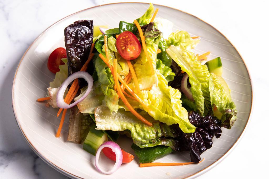 House Salad · Mix greens, carrots, watermelon radish, cherry tomatoes, red onions, cucumbers & lemon dressing