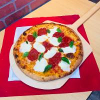 Margherita Pizza · Plum tomatoes, fresh mozzarella, and basil.