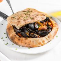 Mussels Barosa · Served in a garlic white wine sauce or red tomato and garlic sauce, inside special brick ove...
