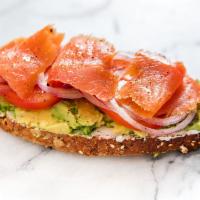 Smoked Salmon Avocado Toast · Smoked salmon with our house guacamole with lemon juice, sea salt, and black pepper all spre...