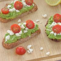 Tomato And Feta Cheese Avocado Toast · Fresh tomato, feta cheese, lemon juice, sea salt, black pepper on sour dough bread.